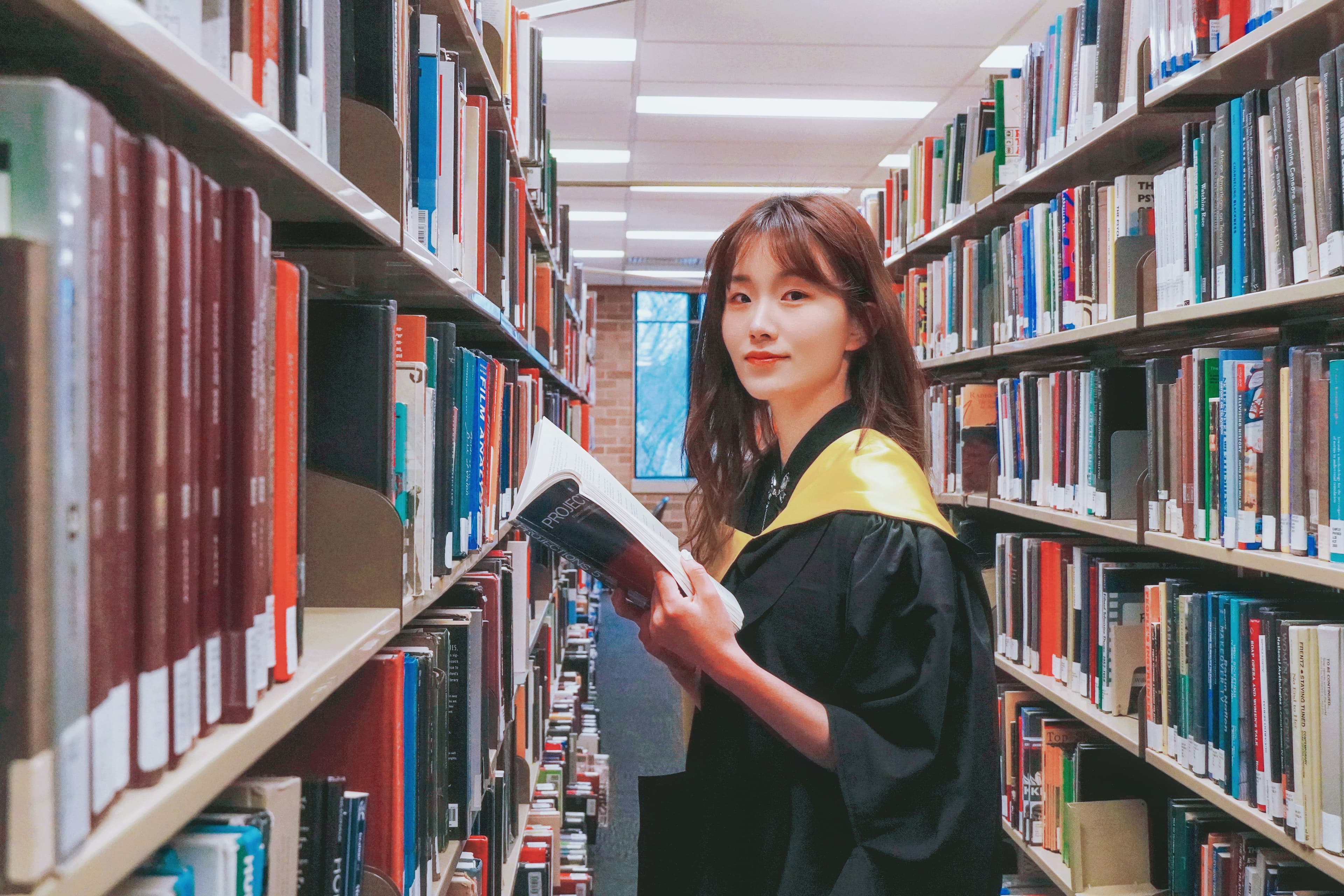 International university graduation ceremony with students in academic gowns